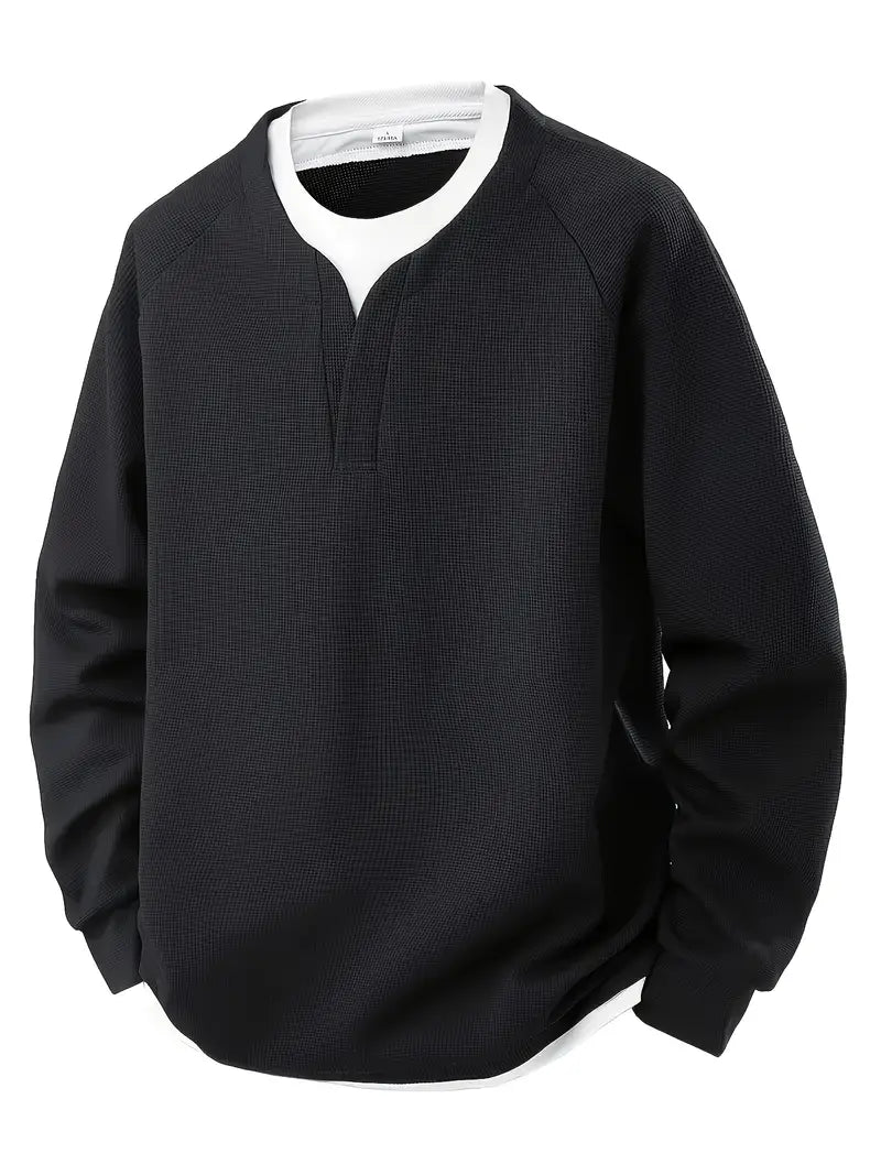“ALTHORA™ Modern Layer Pullover — black pullover with built-in white layer and modern V-neck.”