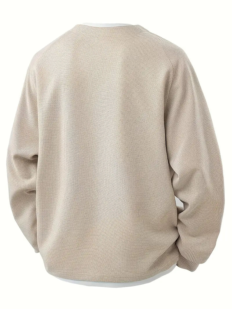 “ALTHORA™ Modern Layer Pullover — black pullover with built-in white layer and modern V-neck.”