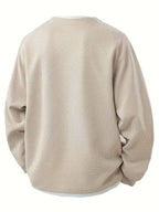 “ALTHORA™ Modern Layer Pullover — black pullover with built-in white layer and modern V-neck.”