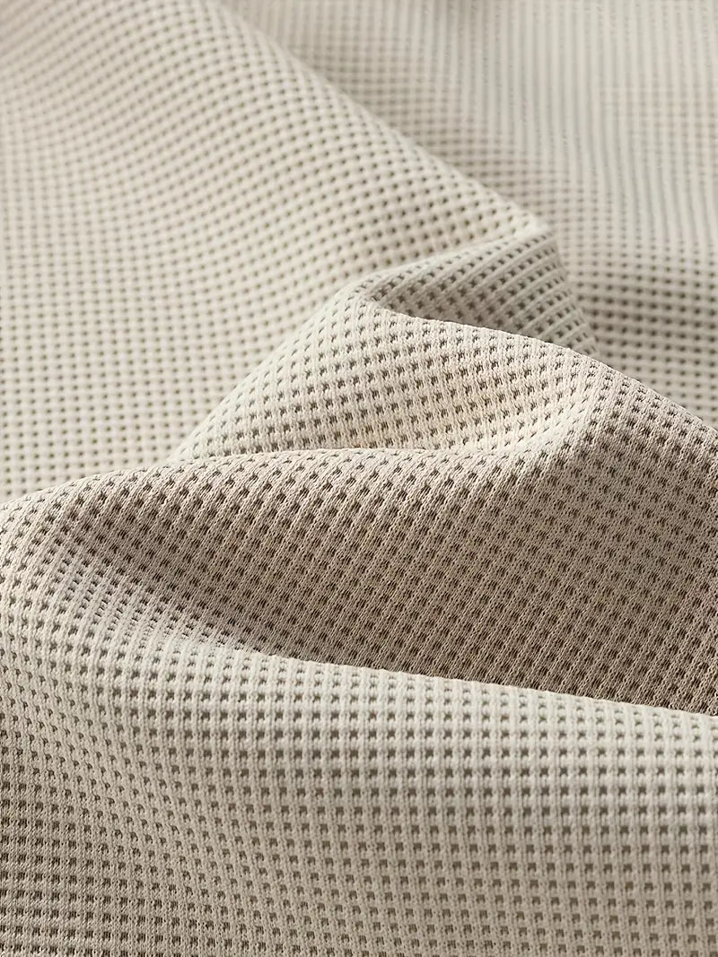 “ALTHORA™ Modern Layer Pullover — black pullover with built-in white layer and modern V-neck.”