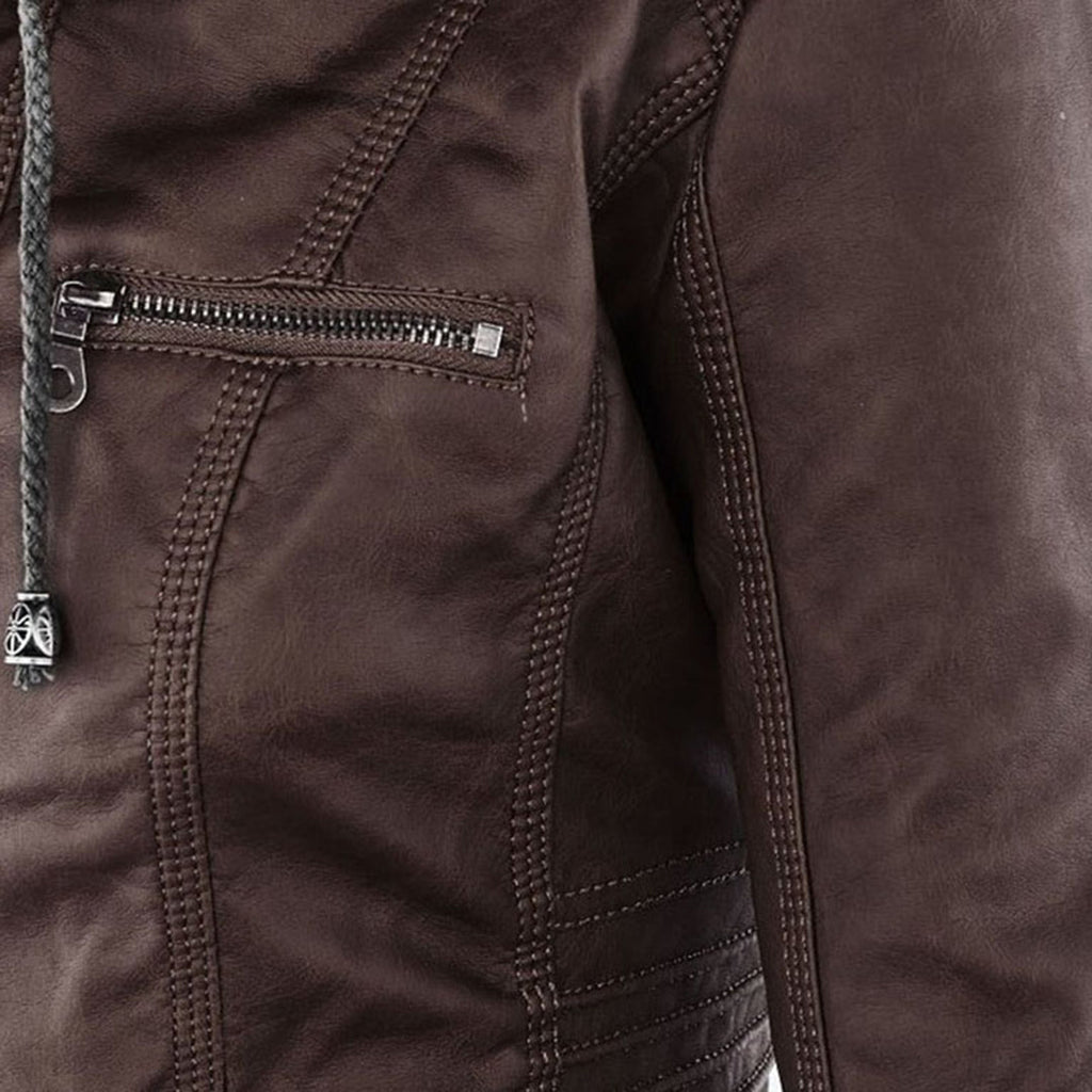 Studio shot of a women's fitted faux leather biker jacket in a warm cognac/light brown colour. The jacket has a front zipper closure, zippered chest and side pockets, detailed quilted shoulder and cuff panels, and an integrated fabric hood with drawstrings. The fit is clearly tailored and slim. Focus on the fitted silhouette and the texture of the faux leather.