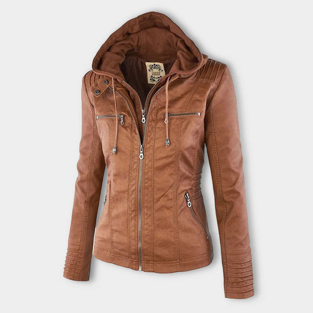 Studio shot of a women's fitted faux leather biker jacket in a warm cognac/light brown colour. The jacket has a front zipper closure, zippered chest and side pockets, detailed quilted shoulder and cuff panels, and an integrated fabric hood with drawstrings. The fit is clearly tailored and slim. Focus on the fitted silhouette and the texture of the faux leather.