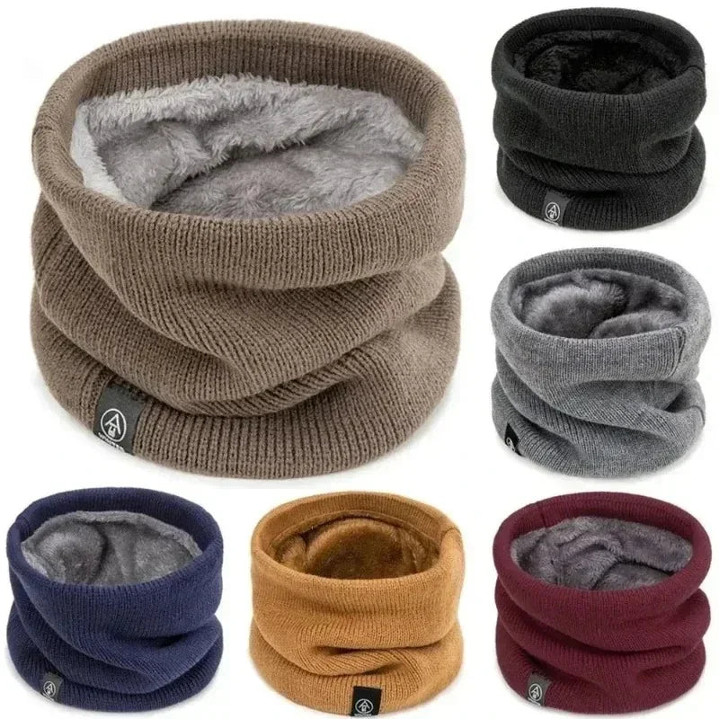 Collage of multiple colours of the ALTHORA fleece-lined thermal neck gaiter/snood. The exterior is a textured rib knit, and the interior lining is visible as a soft, grey fleece/sherpa material. Colours shown include brown, black, navy, grey, mustard, and burgundy. Focus on the plush texture and the variety of colours.