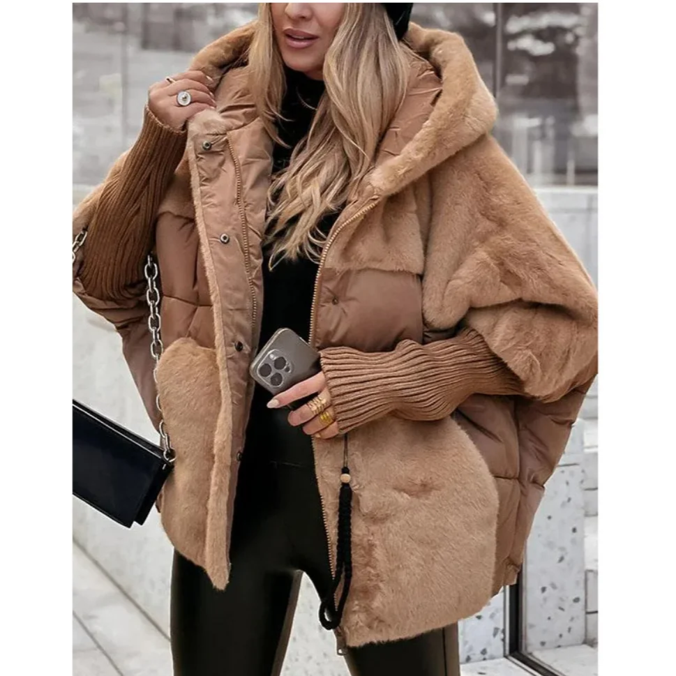 Model wearing Althora Urban Allure Coat in black — plush, oversized winter jacket with fur detailing.