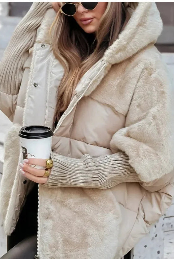 Model wearing Althora Urban Allure Coat in black — plush, oversized winter jacket with fur detailing.